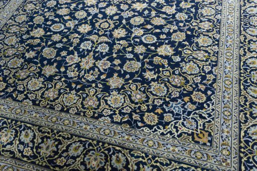 Close-up detail of 2000s Kashan rug from Iran / Persia showing Wool weave