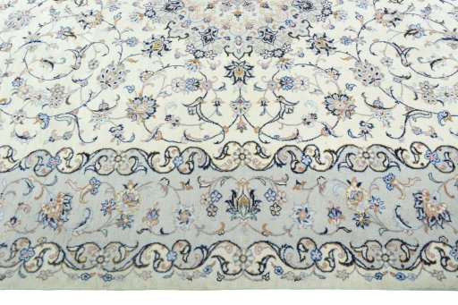 Corner detail of New Kashan rug showing border pattern and Wool pile