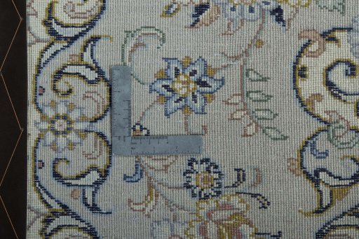 Backside of handmade New Kashan rug showing knot structure and weave density