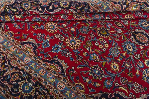Close-up detail of 2000s Kashan rug from Iran / Persia showing Wool weave