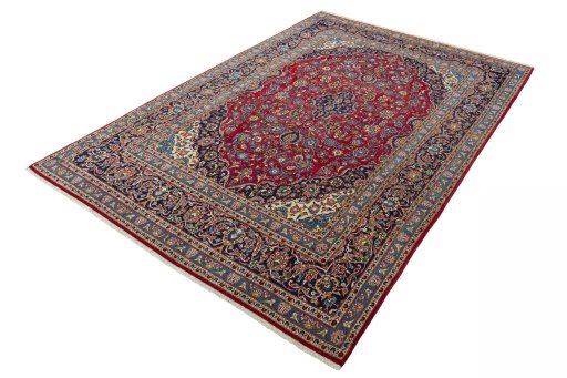 Corner detail of 2000s Kashan rug showing border pattern and Wool pile