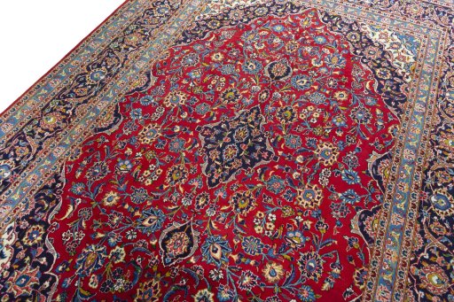 Backside of handmade 2000s Kashan rug showing knot structure and weave density