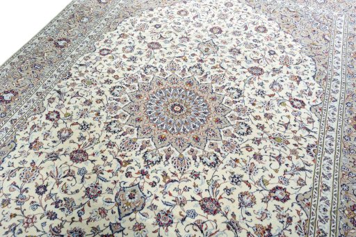 Backside of handmade 2000s Kashan rug showing knot structure and weave density