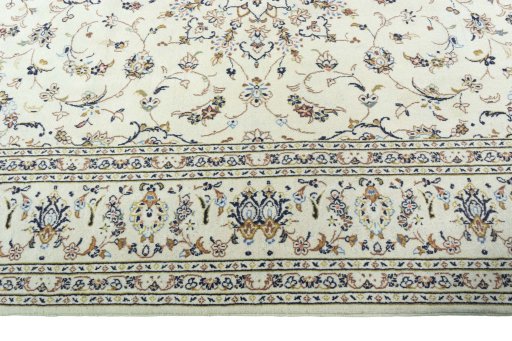 Corner detail of 2000s Kashan rug showing border pattern and Wool pile