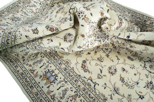 Surface texture of 2000s Kashan rug with natural Wool and intricate pattern
