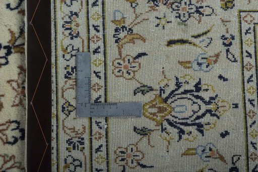 Backside of handmade 2000s Kashan rug showing knot structure and weave density