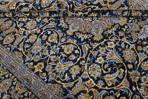 Close-up detail of 2000s Kashan rug from Iran / Persia showing Wool weave