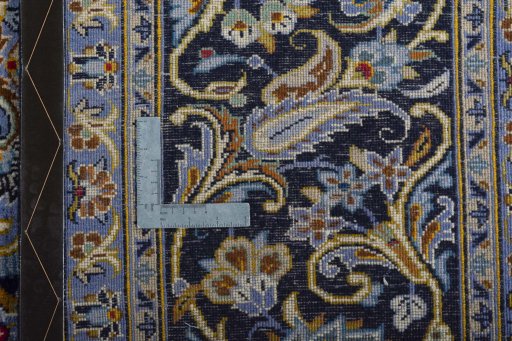 Backside of handmade 2000s Kashan rug showing knot structure and weave density