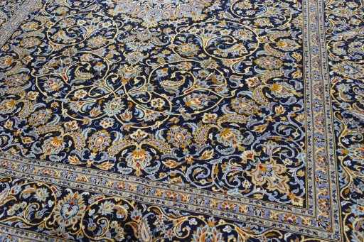 Close-up detail of 2000s Kashan rug from Iran / Persia showing Wool weave