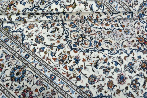 Close-up detail of 2000s Kashan rug from Iran / Persia showing Wool weave
