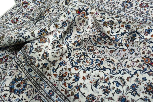 Surface texture of 2000s Kashan rug with natural Wool and intricate pattern