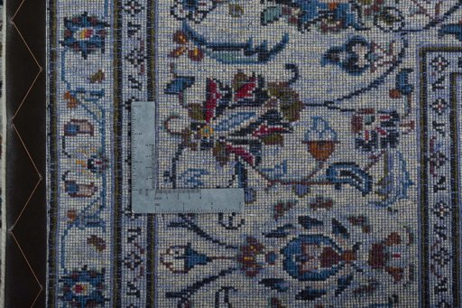 Backside of handmade 2000s Kashan rug showing knot structure and weave density