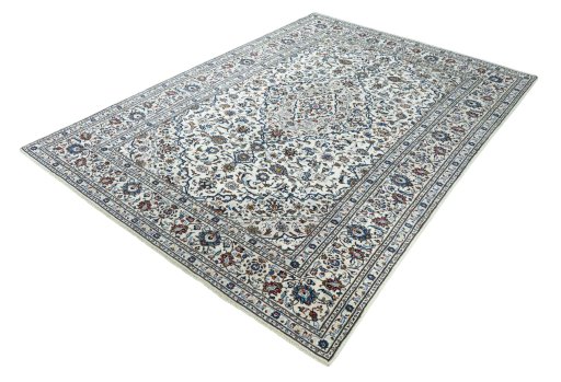 Corner detail of 2000s Kashan rug showing border pattern and Wool pile