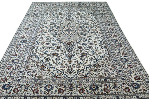 Surface texture of 2000s Kashan rug with natural Wool and intricate pattern