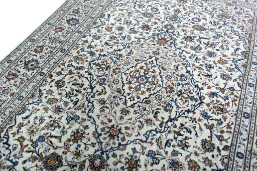 Backside of handmade 2000s Kashan rug showing knot structure and weave density