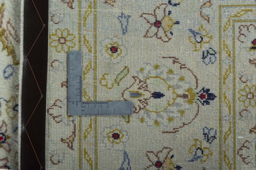 Backside of handmade New Kashan rug showing knot structure and weave density