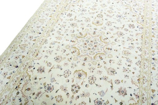 Backside of handmade New Kashan rug showing knot structure and weave density