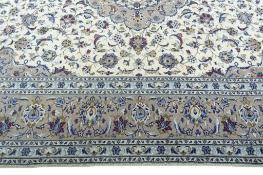Corner detail of 2000s Kashan rug showing border pattern and Wool pile