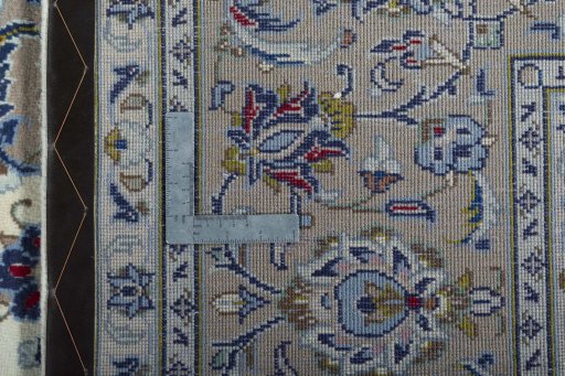 Backside of handmade 2000s Kashan rug showing knot structure and weave density