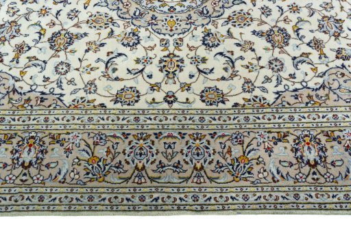 Corner detail of 2000s Kashan rug showing border pattern and Wool pile