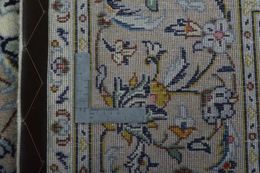 Backside of handmade 2000s Kashan rug showing knot structure and weave density