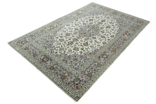 Corner detail of 2000s Kashan rug showing border pattern and Wool pile