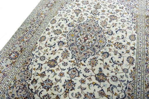 Backside of handmade 2000s Kashan rug showing knot structure and weave density