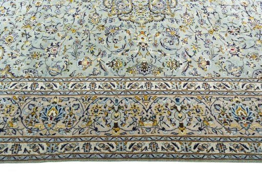 Corner detail of 2000s Kashan rug showing border pattern and Wool pile