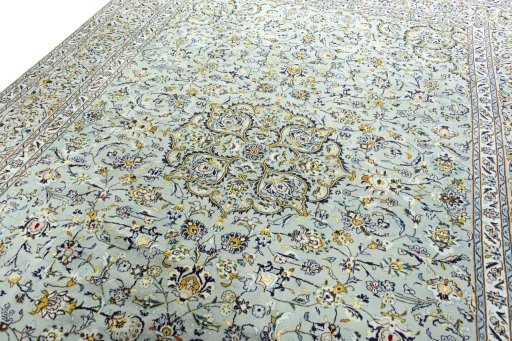 Backside of handmade 2000s Kashan rug showing knot structure and weave density
