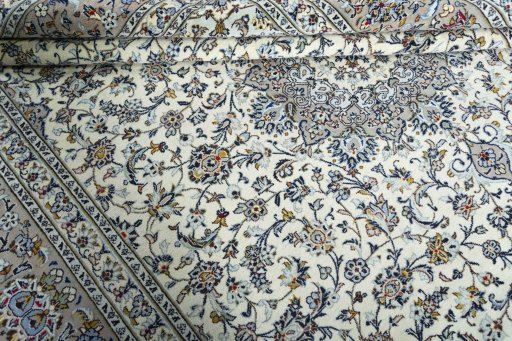 Close-up detail of 2000s Kashan rug from Iran / Persia showing Wool weave
