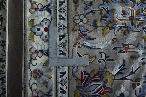 Backside of handmade 2000s Kashan rug showing knot structure and weave density