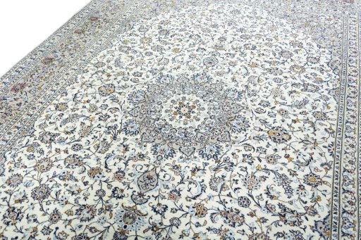 Backside of handmade 2000s Kashan rug showing knot structure and weave density