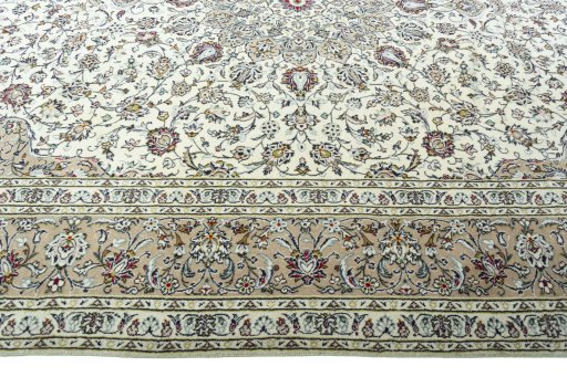 Corner detail of 2000s Kashan rug showing border pattern and Wool pile
