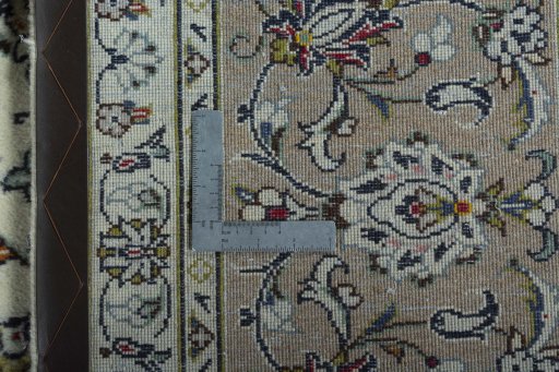 Backside of handmade 2000s Kashan rug showing knot structure and weave density