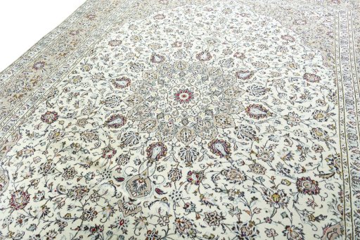 Backside of handmade 2000s Kashan rug showing knot structure and weave density