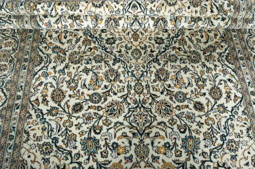 Close-up detail of 2000s Kashan rug from Iran / Persia showing Wool weave