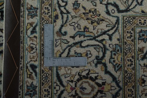 Backside of handmade 2000s Kashan rug showing knot structure and weave density