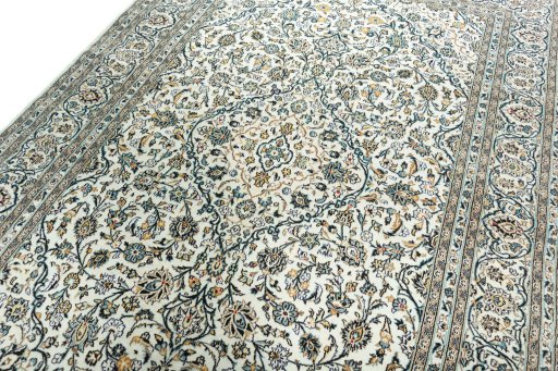 Backside of handmade 2000s Kashan rug showing knot structure and weave density