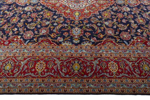 Corner detail of New Kashan rug showing border pattern and Cork pile