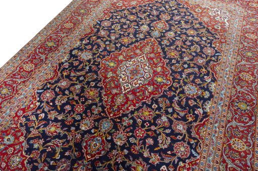 Backside of handmade New Kashan rug showing knot structure and weave density