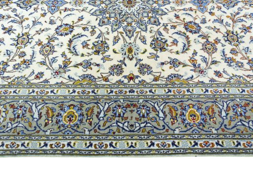 Corner detail of 2000s Kashan rug showing border pattern and Wool pile