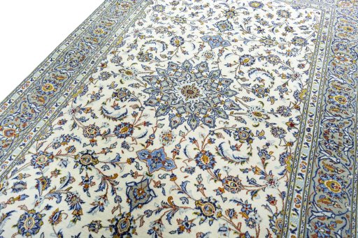 Backside of handmade 2000s Kashan rug showing knot structure and weave density