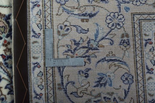 Backside of handmade 2000s Kashan rug showing knot structure and weave density