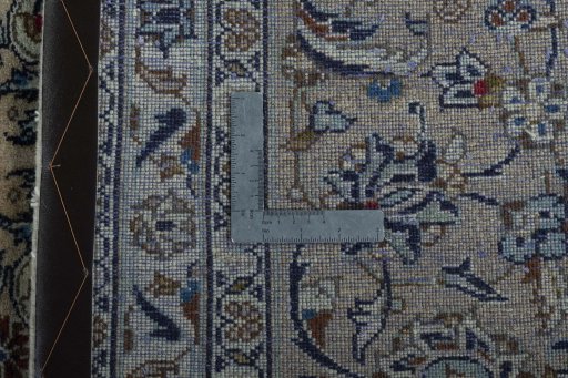 Backside of handmade 2000s Kashan rug showing knot structure and weave density