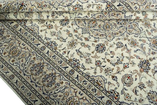 Close-up detail of 2000s Kashan rug from Iran / Persia showing Wool weave