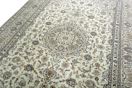 Backside of handmade 2000s Kashan rug showing knot structure and weave density