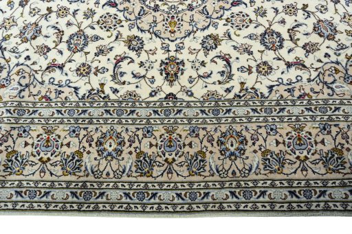 Corner detail of 2000s Kashan rug showing border pattern and Wool pile