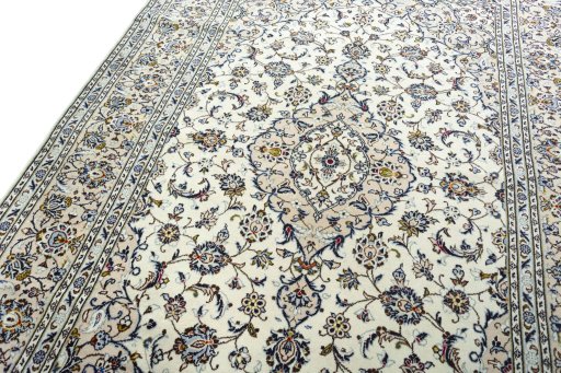 Backside of handmade 2000s Kashan rug showing knot structure and weave density