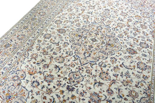 Backside of handmade 2000s Kashan rug showing knot structure and weave density