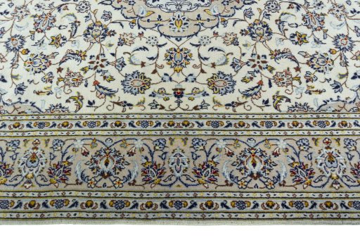 Corner detail of 2000s Kashan rug showing border pattern and Wool pile